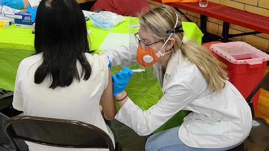 pharmacy student gives a flu shot