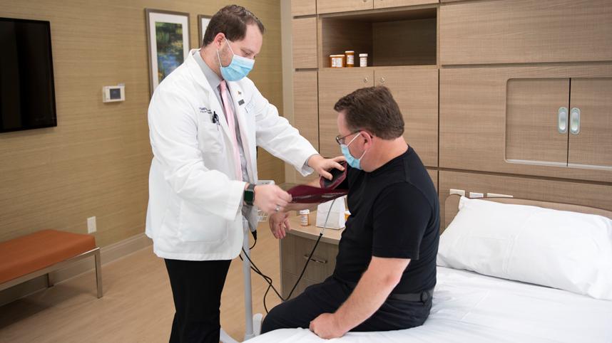 Pharmacist takes blood pressure of a patient