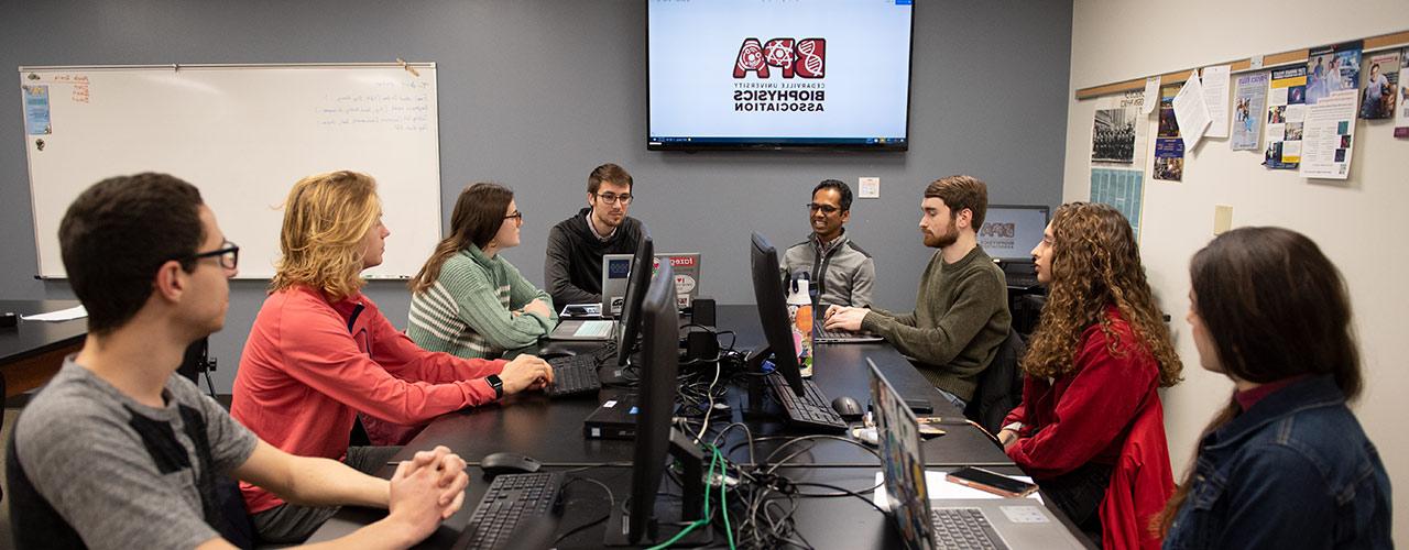 Dr. Mohan Pereira meets with members of the Biophysics Association