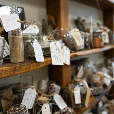 picture of glass objects with tags on a shelf in the Cove